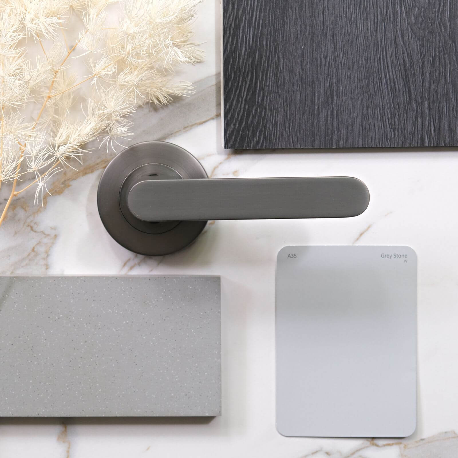 Taubmans Grey Stone colour card with Hanwood floor board and Think Benchtops sample gun metal grey 15