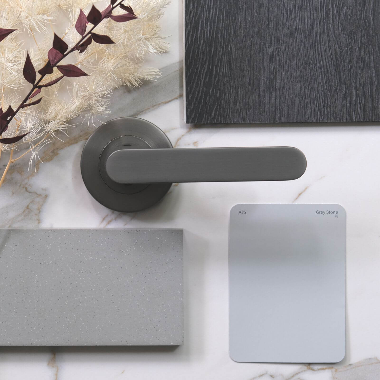 Moodboard featuring the Almeri gun metal grey passage lever with Taubmans Grey Stone colour card gun metal grey 16