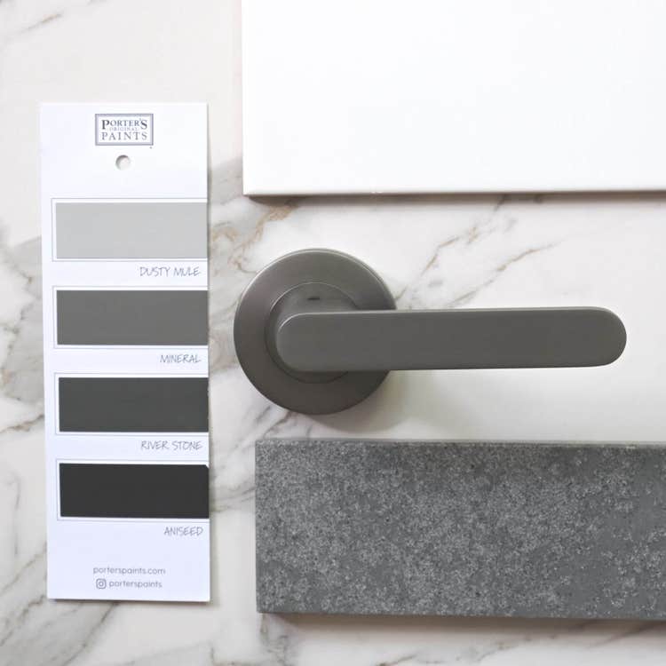 Gunmetal grey door handle with paint and material samples